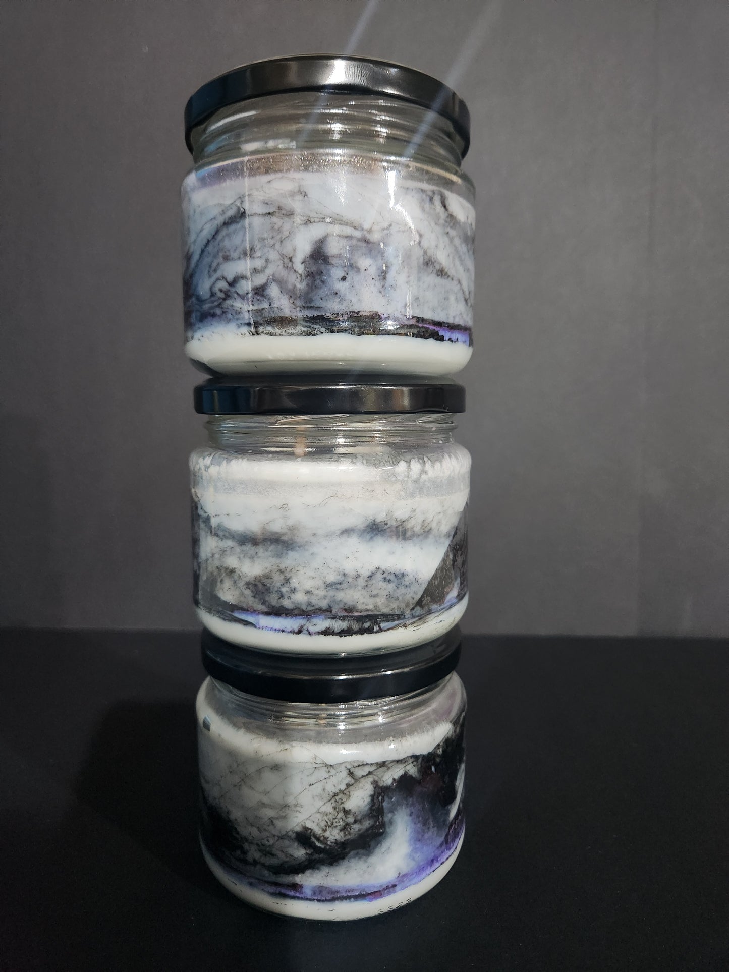 The Candle Shelf. Handmade Custom Bookish Soy Wax Candles inspired by those unforgettable moments between the pages. Beautifully marbled glass container jar candles. Shadow Daddy, Star Dust, The Last Page. Pillar candles. Book candle. Heats candle. Forest, floral and leaves candle. Their fancy and deliciously scented. The perfect decor item for your home, office, wedding or even as a gift. We offer customised labels and candle colours. Each candle is made to order.  All candles are made from NZ sourced wax.