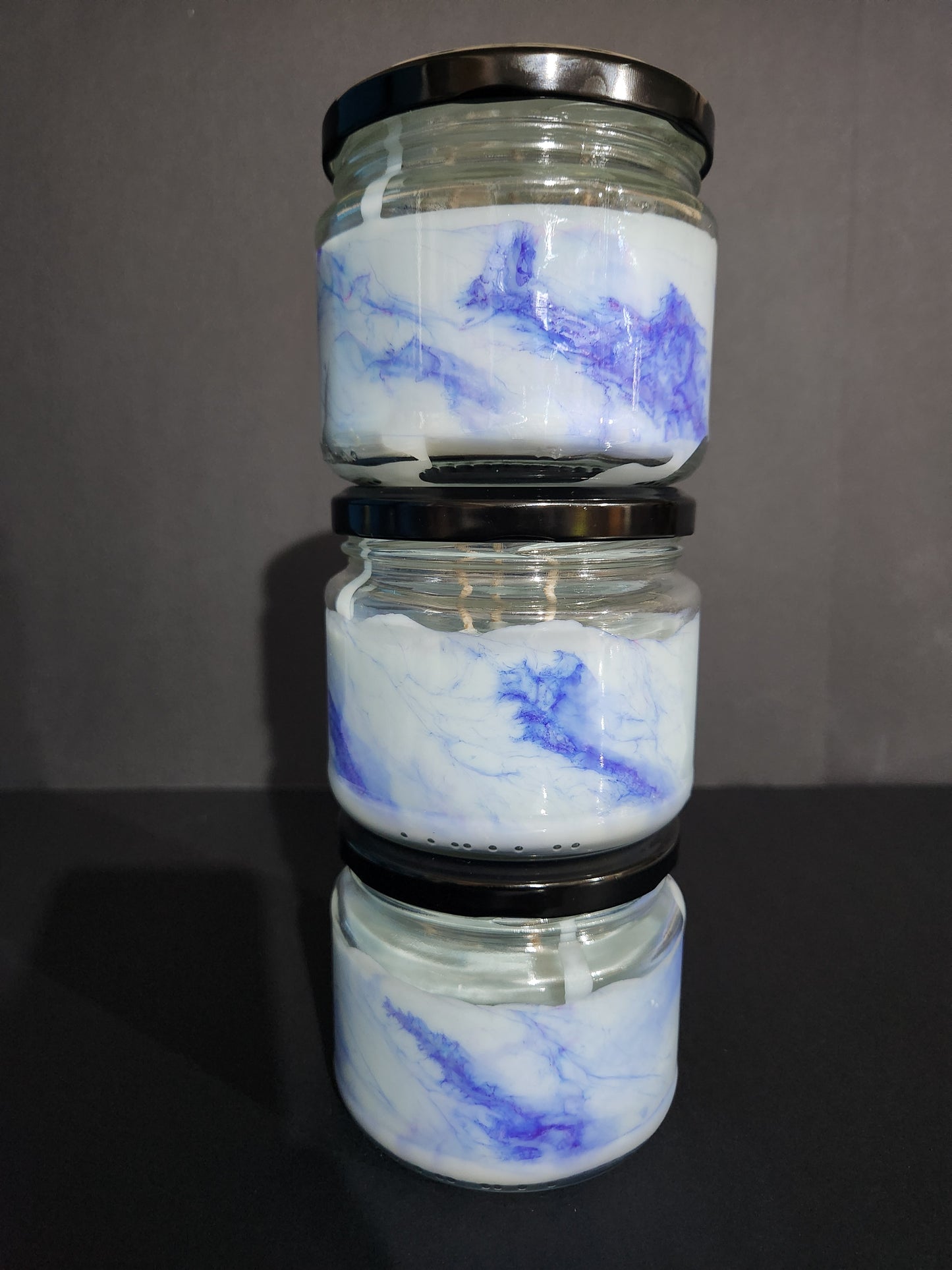 The Candle Shelf. Handmade Custom Bookish Soy Wax Candles inspired by those unforgettable moments between the pages. Beautifully marbled glass container jar candles. Shadow Daddy, Star Dust. Personalised. Pillar candles. Book candle. Heats candle. Forest, floral and leaves candle. Their fancy and deliciously scented. The perfect decor item for your home, office, wedding or even as a gift. We offer customised labels and candle colours. Each candle is made to order.  All candles are made from NZ sourced wax.